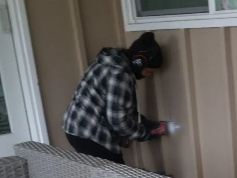 Professional electrician installing an exterior outlet in Brandenburg